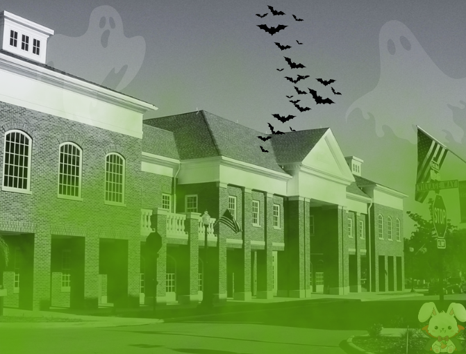 Black and white photo of the front of the Hudson Library with green smog on top and graphics of 2 ghosts, bats and a vampire bunny. 