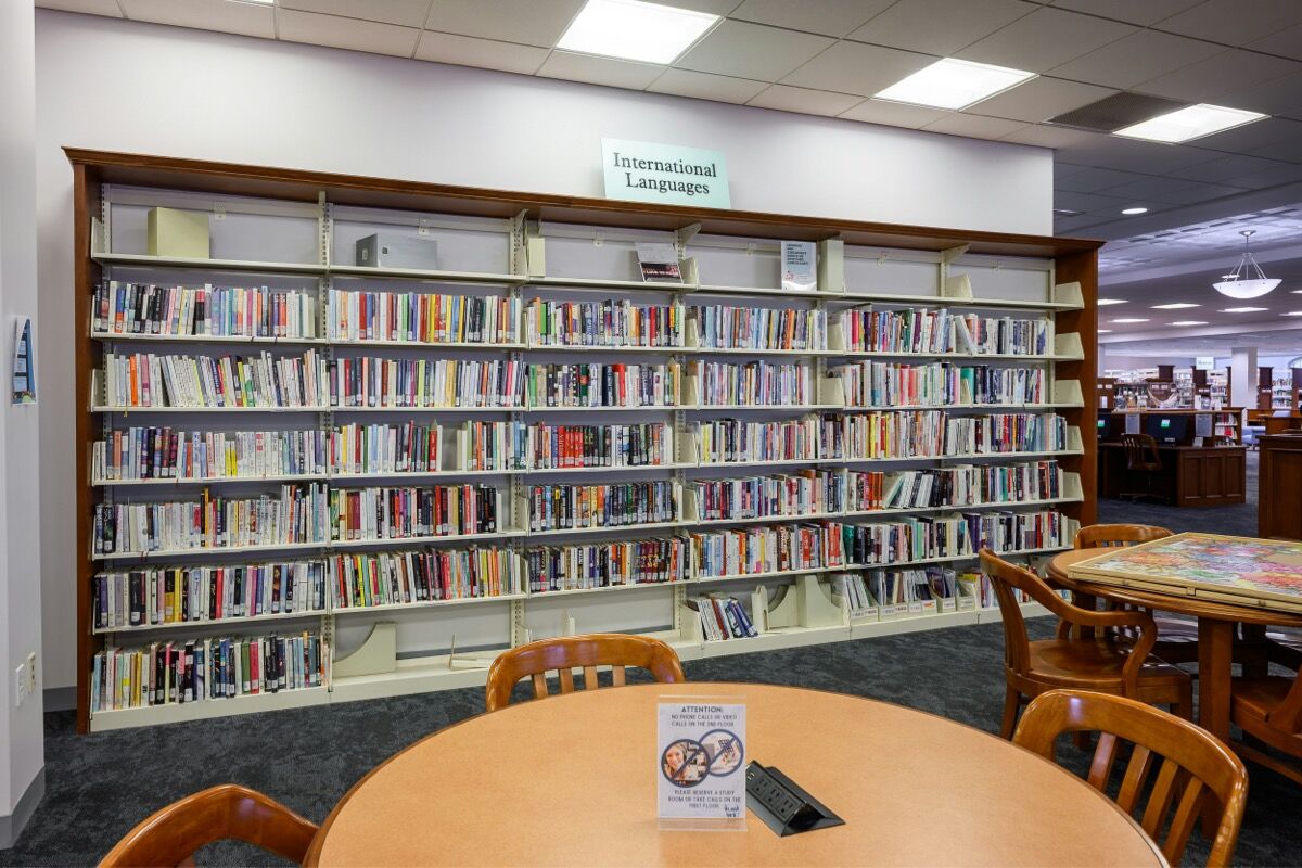 Bookshelves with sign at top that reads, "International Languages"